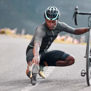 outdoor-cycling-cyclist-doing-stretching-exercise-by-his-bicycle-road-mountain-sports-training-fitness-man-athlete-doing-warm-up-before-cardio-cycle-workout-with-bike-nature_590464-96124